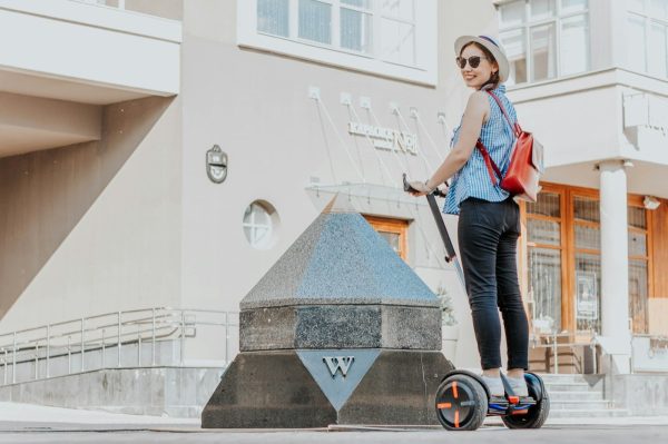 Photo by Timur Romanov woman in a ride-on balancing board