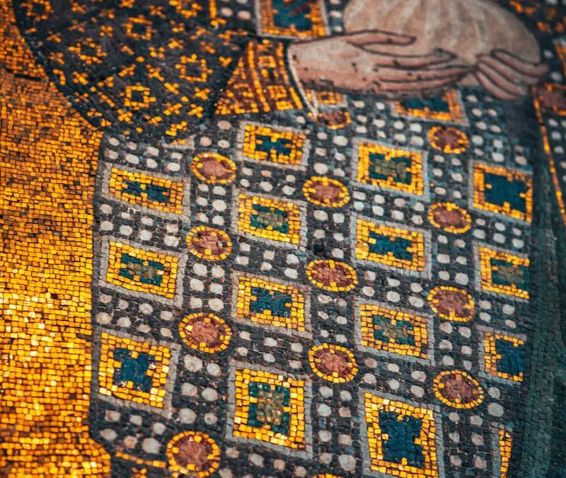 man in white and blue robe print textile